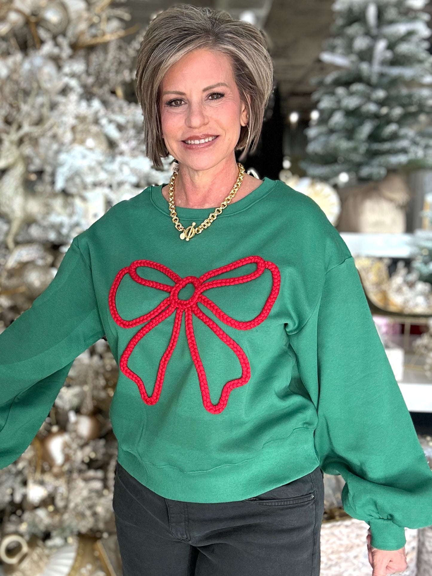 A Holiday Bow Sweatshirt in Green