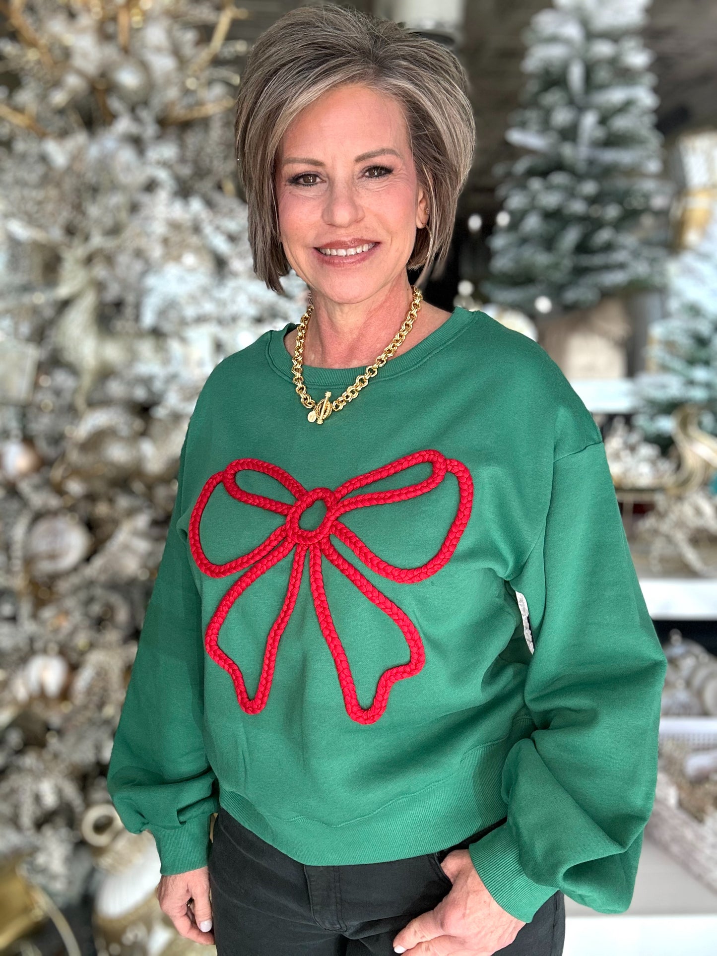 A Holiday Bow Sweatshirt in Green