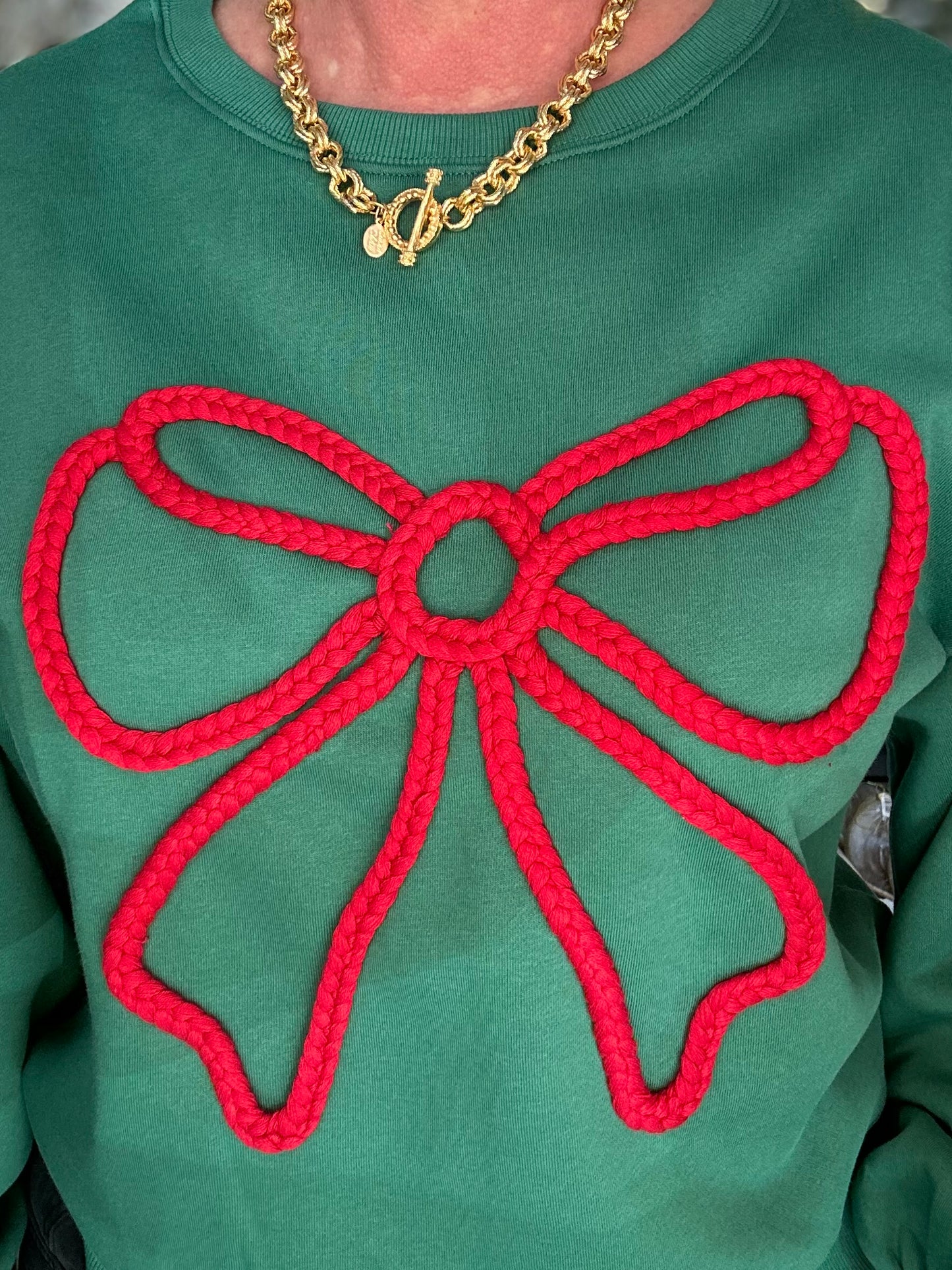 A Holiday Bow Sweatshirt in Green